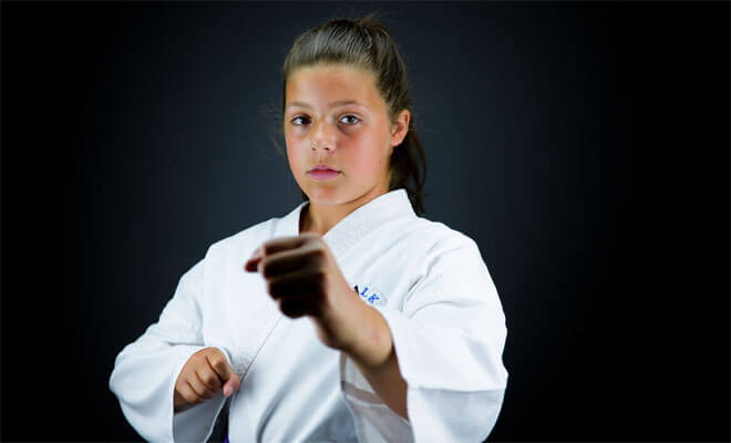 a photo of our client Halle taking part in Karate